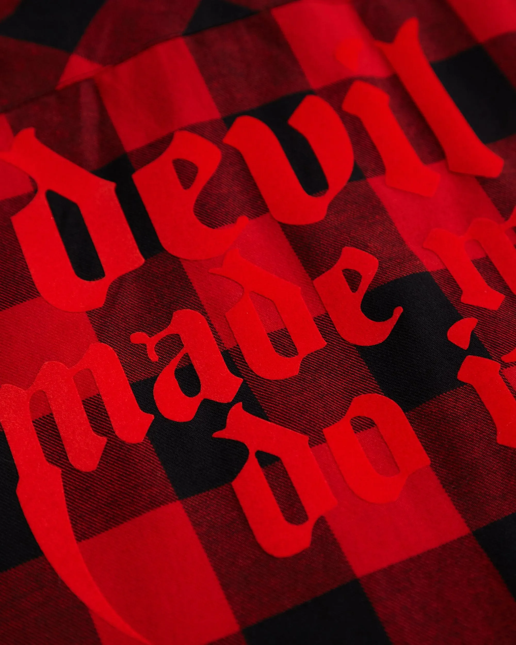 Devil made me do it, red flock on sleeveless checked flannel shirt